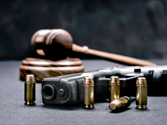 bullets and gun on table